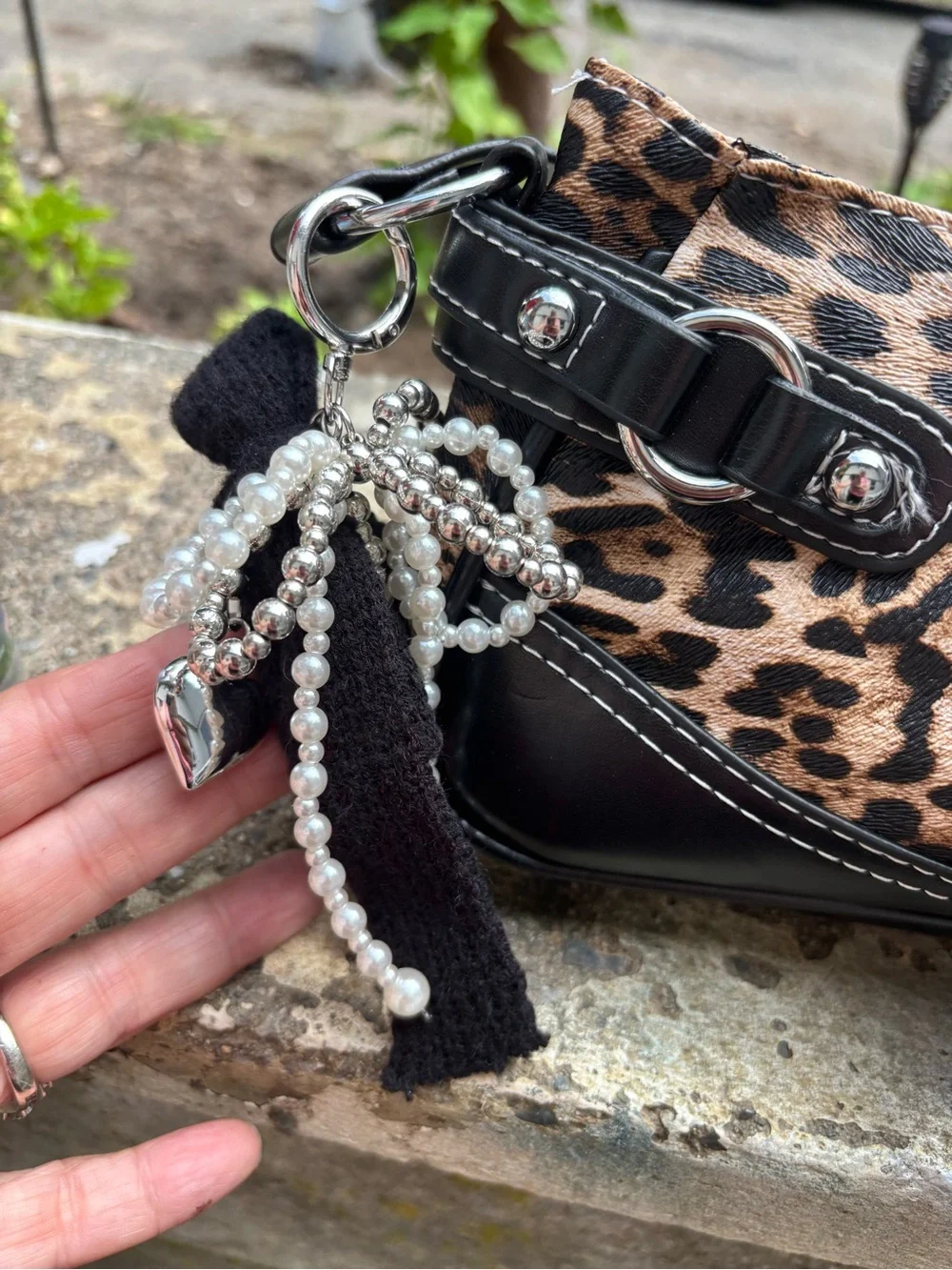 Leopard Print Shoulder Bag with Black Trim and Buckle Accent